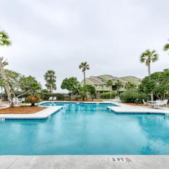 Three-story ocean-view villa with pool, balcony, charcoal grill, & central AC