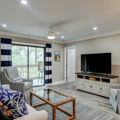Fully updated condo with serene view, enclosed balcony, WiFi, W/D, pool, & gym