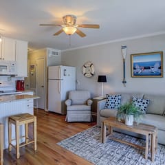 Beachfront condo with pool, beach access, pier, private balcony, & central AC