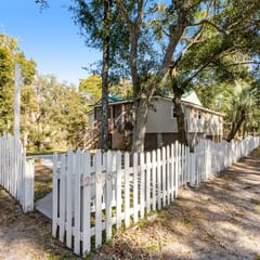 Welcoming home steps to the beach and downtown with WiFi and screened porch