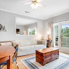 2nd-floor retreat with screened porch, shared pool, WiFi, central AC & elevator