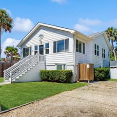 Charming home with enclosed porch, WiFi, & central AC - walk to beach and shops