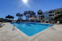 1st-floor condo with beach access, patio, & outdoor pool - snowbirds welcome