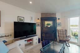 1st-floor riverfront condo w/spectacular river views, balcony, and central AC