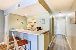 2-story riverfront condo with 2 balconies, outdoor pool, grills, river views, AC