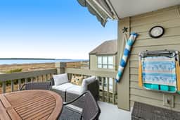2nd floor villa with water views, lovely balcony & w/d - walk to Beach Club