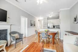 2nd-floor retreat with screened porch, shared pool, WiFi, central AC & elevator