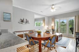 2nd-floor retreat with screened porch, shared pool, WiFi, central AC & elevator