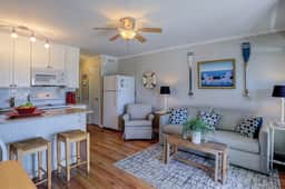 Beachfront condo with pool, beach access, pier, private balcony, & central AC