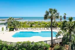 Beachfront condo with pool, beach access, pier, private balcony, & central AC