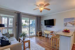 Beachfront condo with pool, beach access, pier, private balcony, & central AC