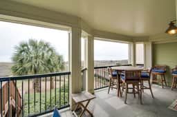Beachfront villa w/ ocean views, private deck, pool access – steps from beach
