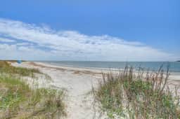 Beachfront villa with dolphin viewing deck, shared pools, tennis, golf & more