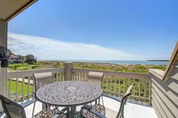 Beachfront villa with dolphin viewing deck, shared pools, tennis, golf & more