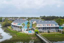 Beachy, three-story villa w/ deck & shared pool - walk downtown & to the beach