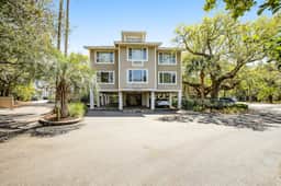 Beautiful villa surrounded by lush landscaping - walk to beach, golf & pool