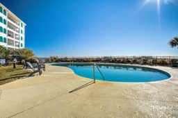 Bright and spacious condo with beach & ocean views, pool, basketball & balcony