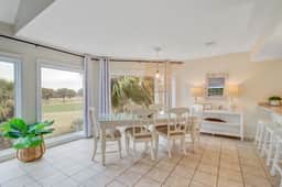 Bright villa with lagoon & fairway views - walk to the beach & golf