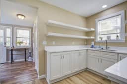 Charming home steps from beach with two full kitchens, deck, patio, WiFi & AC
