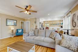 Charming home with enclosed porch, WiFi, & central AC - walk to beach and shops