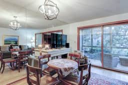 Comfortable ground-floor condo with enclosed patio, washer/dryer, & AC