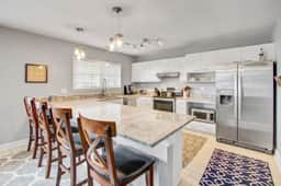 Convenient dog-friendly retreat steps from the beach with grill & screened porch