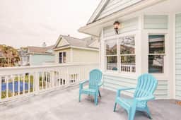 Elegant home on the boardwalk with 2 balconies & shared pools - walk to beach