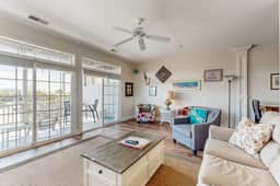 First-floor villa w/partial ocean views, covered porch -one block from the beach