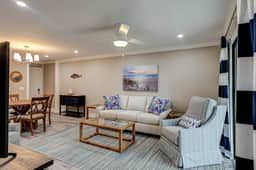 Fully updated condo with serene view, enclosed balcony, WiFi, W/D, pool, & gym
