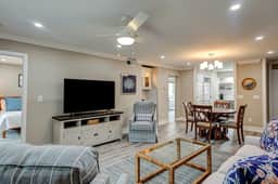 Fully updated condo with serene view, enclosed balcony, WiFi, W/D, pool, & gym