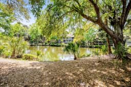 Lagoon view, second floor villa w/ screened in porch, short walk to the beach