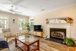 Palmetto-lined home with porches, yard & hammock - walk to beach/town
