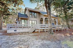 Private home with large deck and views of a lagoon – walk or bike to the beach
