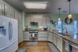 Raised oceanfront home with elevator & outdoor shower just steps from beach