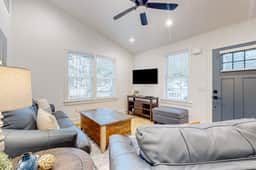 Renovated charmer with chef's kitchen, front porch, work desk, AC, & firepit