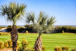 Renovated lagoon-view condo with screened porch & WiFi - steps from the beach