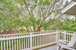 Renovated townhome next to golf course w/ community pool access- close to beach