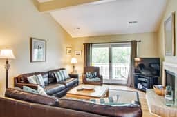 Renovated townhome next to golf course w/ community pool access- close to beach