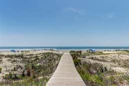 Second floor oceanfront villa with deck & full kitchen super close to the beach
