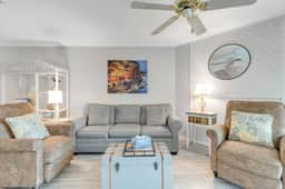 Second-floor villa w/ river views & community pool, tennis courts, and dock