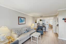 Second-floor villa with lovely ocean views, pickleball, pool & screened deck