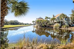 Stylish beach villa with three decks, and golf course views