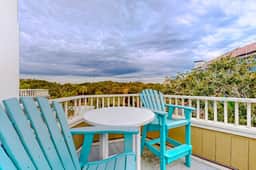 Two-story condo near beach with on-site pool & screened deck