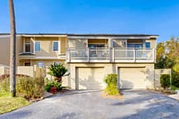 Updated townhouse with outside deck, shared pool, tennis, pickleball and beach