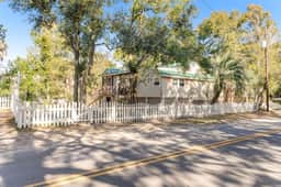 Welcoming home steps to the beach and downtown with WiFi and screened porch