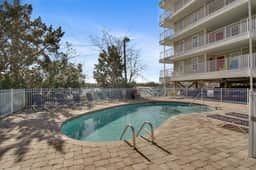 Second-floor condo with river views and access to a community pool - Image 3