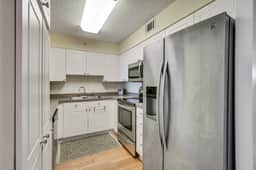 Second-floor condo with river views and access to a community pool - Image 2