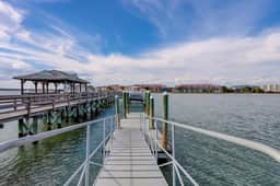 Inviting waterfront townhouse with beach access, balcony, W/D, pool & dock - Image 3