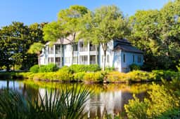 Lagoon view, second floor villa w/ screened in porch, short walk to the beach - Image 3