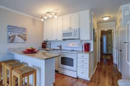 Beachfront condo with pool, beach access, pier, private balcony, & central AC - Image 3